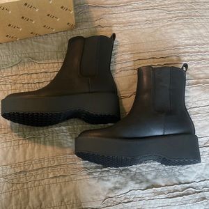 Black size 7 slip on combat boot NEVER WORN